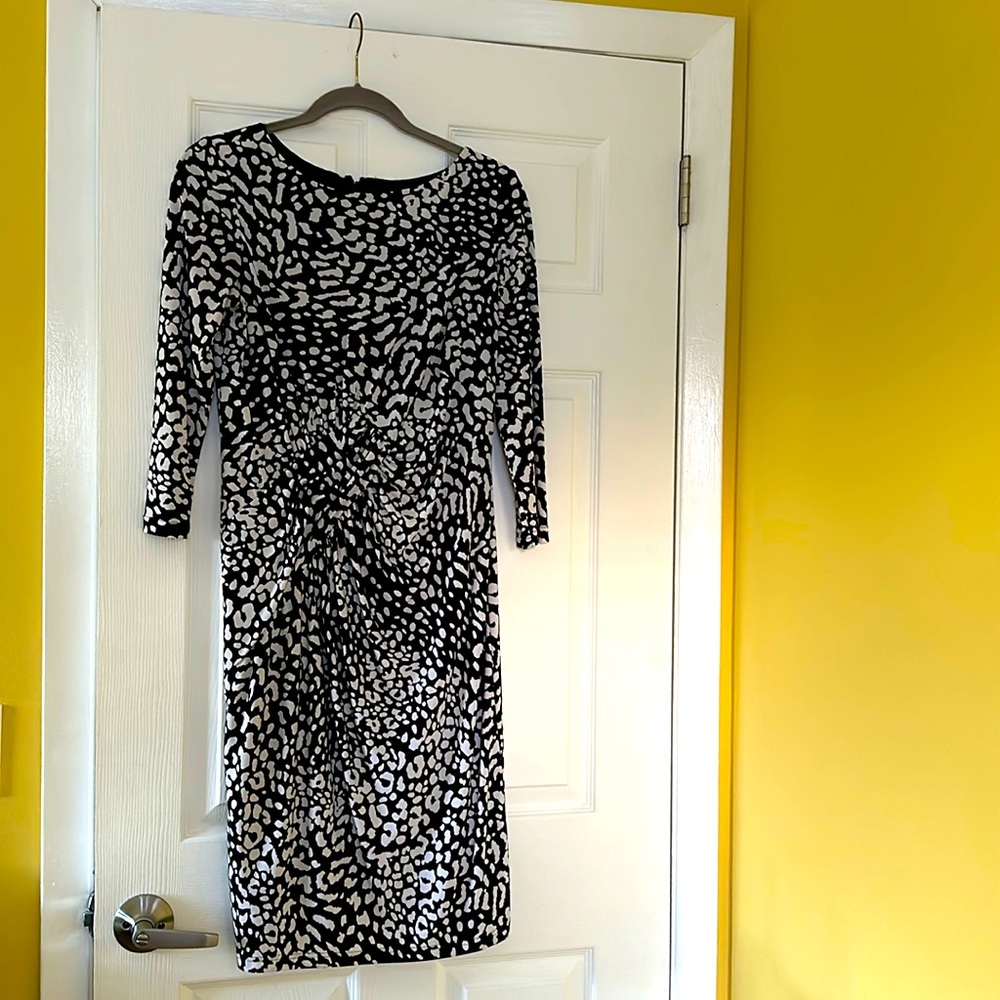 Black and white dress with some rushing right in the middle